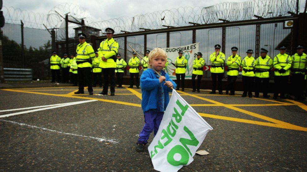 Two-year-old Orrin Whitehead-St Pierre demonstrates outside the Faslane submarine base, August 23, 2004 near Glasgow in Scotland. Up to two hundred people gathered to protest against Trident missiles being deployed at the high security base, claiming it was Britain's own stock of Weapons of Mass Destruction
