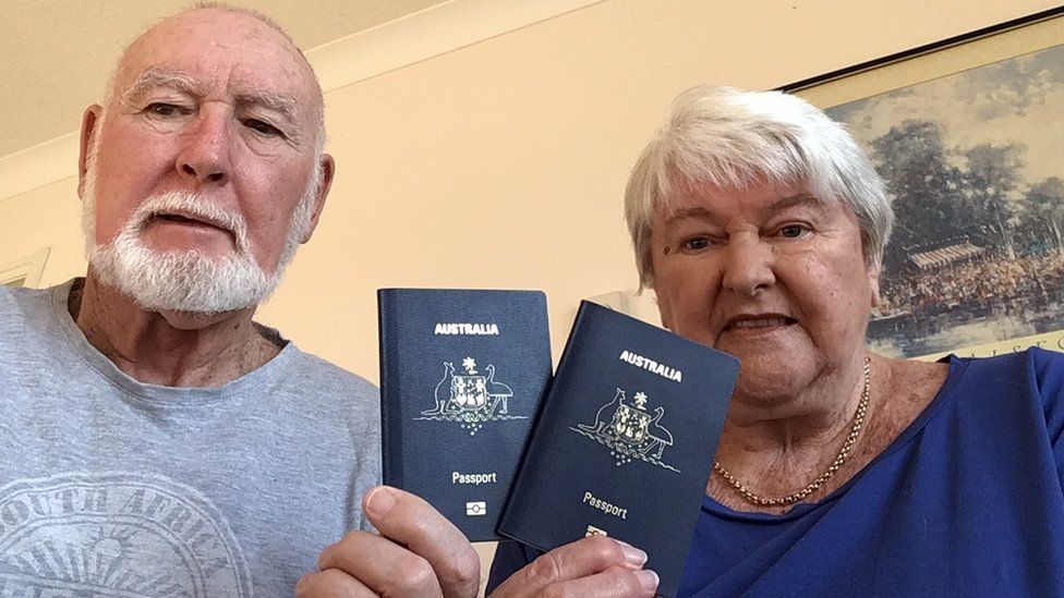 John and Margaret Sparks hold up their Australian passports