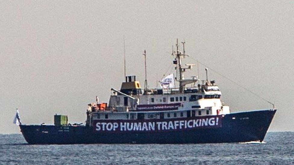 A banner that reads, "Stop Human Trafficking" is attached to the side of the C-Star as it sailed in the Mediterranean Sea