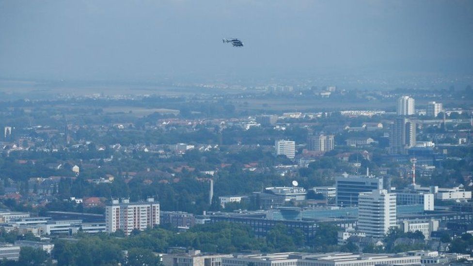 A police helicopter observes the danger zone as about 65,000 people in Frankfurt evacuate part of the city while experts defuse an unexploded British World War Two bomb