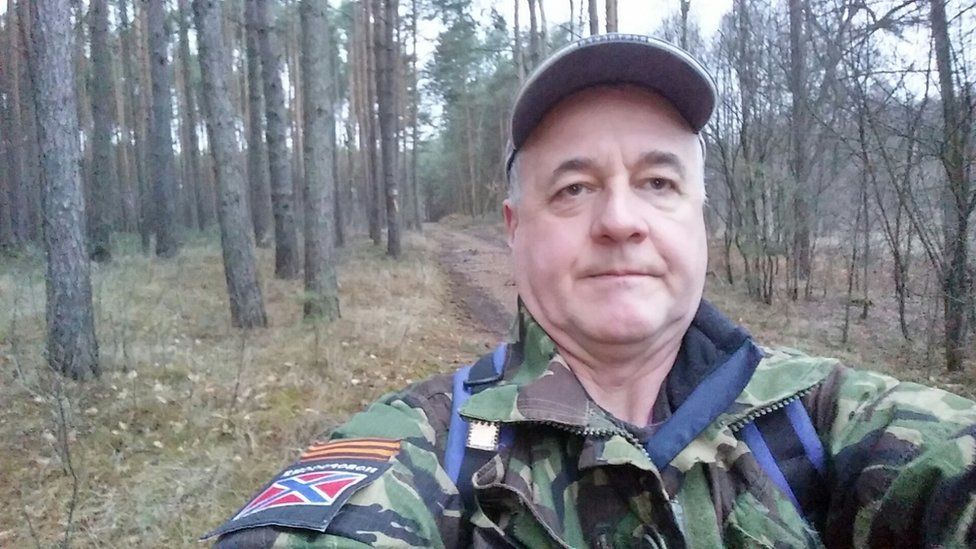 David Smith selfie in woods wearing military style clothing