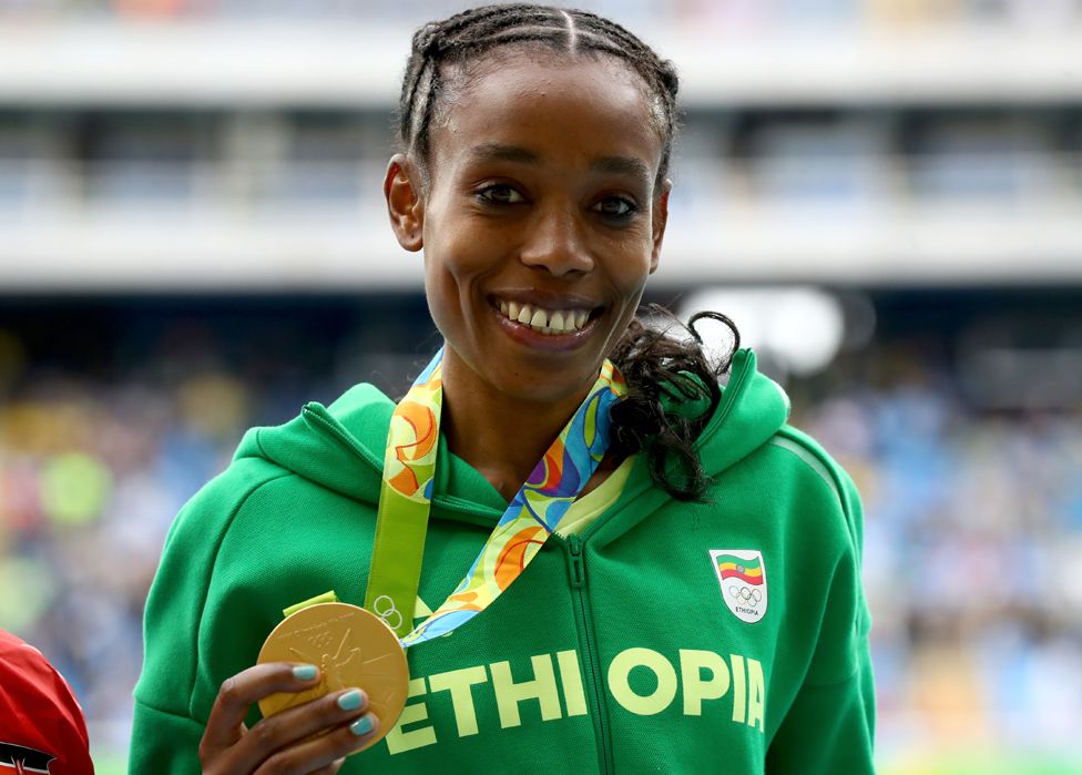 Almaz Ayana of Ethiopia poses with the gold medal for the Women's 10,000 Meters Final after setting a new world record of 29:17.45 on Day 7 of the Rio 2016 Olympic Games