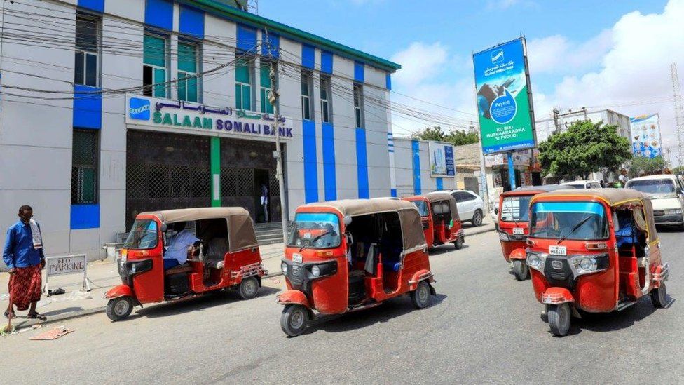 Rickshaw taxis drive past the Salaam Somali Bank in Wadajir district of Mogadishu, Somalia October 14, 2020.