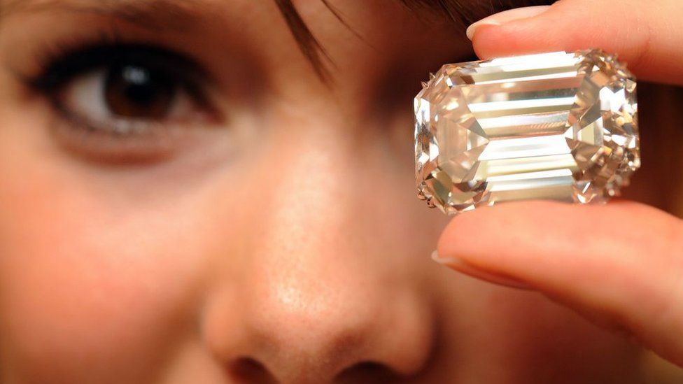 A Sotheby's employee displays the famous Lesotho I diamond during an auction preview on November 12, 2008 in Geneva.
