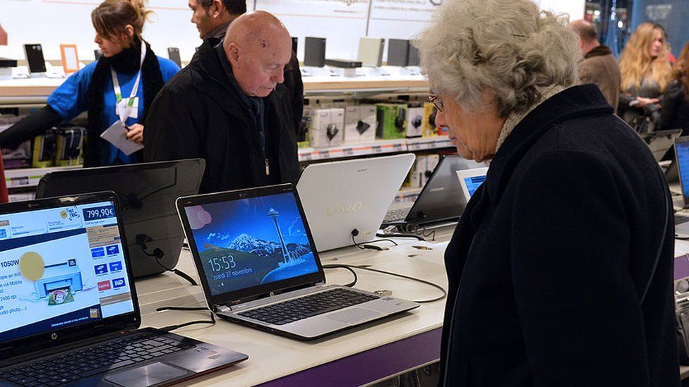Woman looking at laptop