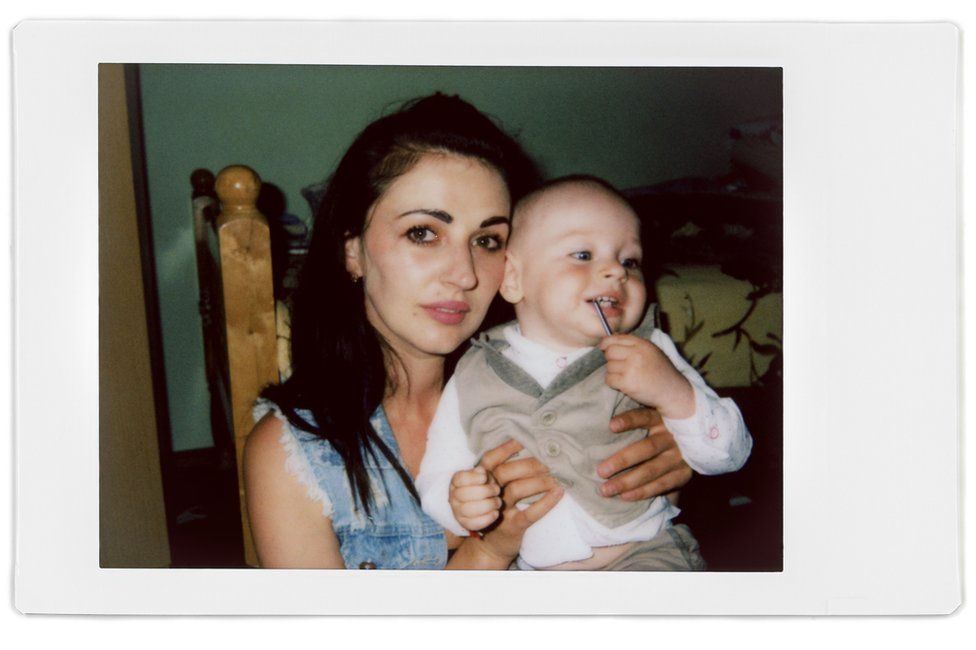 A polaroid photo of Alina and her son