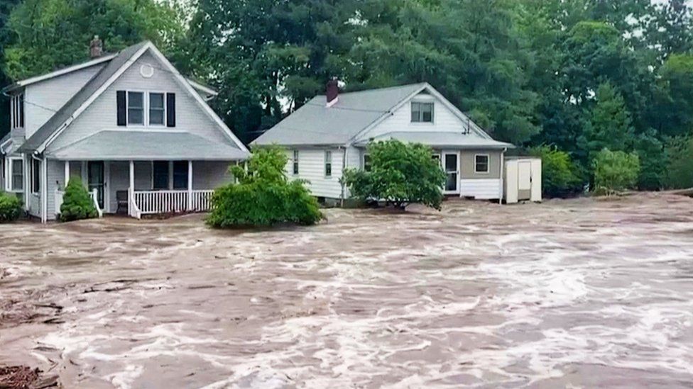 Houses surrounded by flooding
