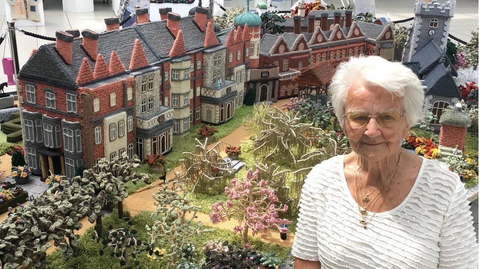 Margaret Seaman by her knitted Sandringham Estate