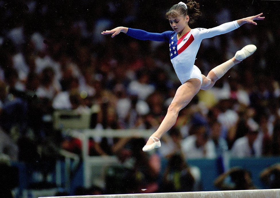 23 Jul 1996: Dominique Moceanu of the USA leaps during the Women's Beam event at the Georgia Dome in the 1996 Olympic Games in Atlanta, Georgia.