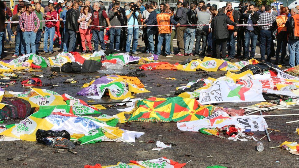 Bodies covered in flags after blasts in Ankara, Turkey, Saturday 10 October 2015