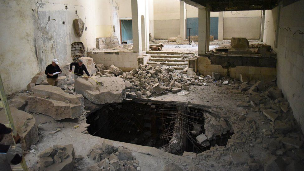 Crater in floor caused by IS bomb