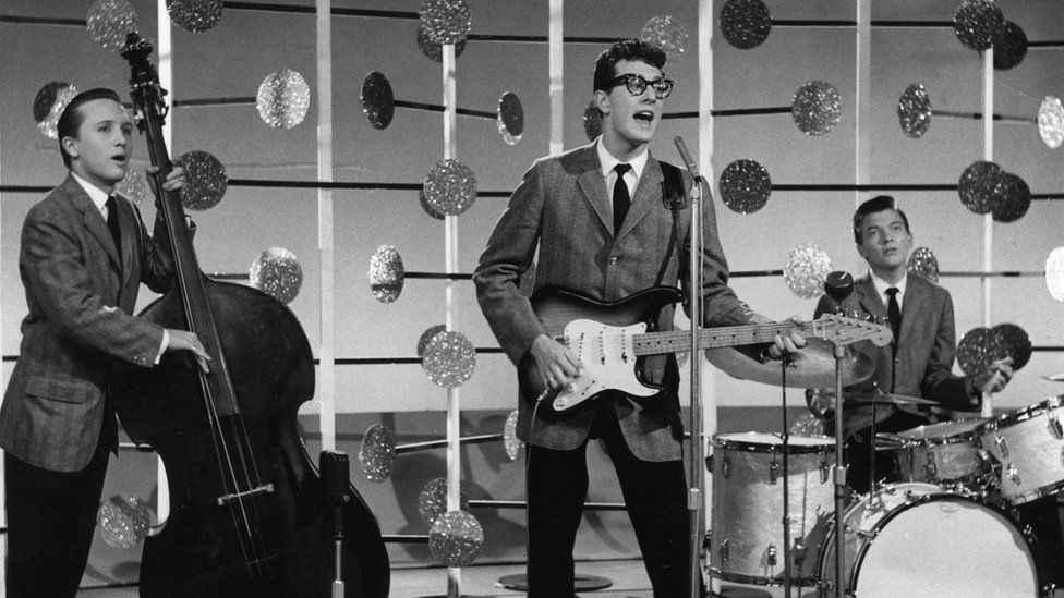 Joe Maulden, left, Buddy Holly, centre, and Jerry Allison on drums as The Crickets