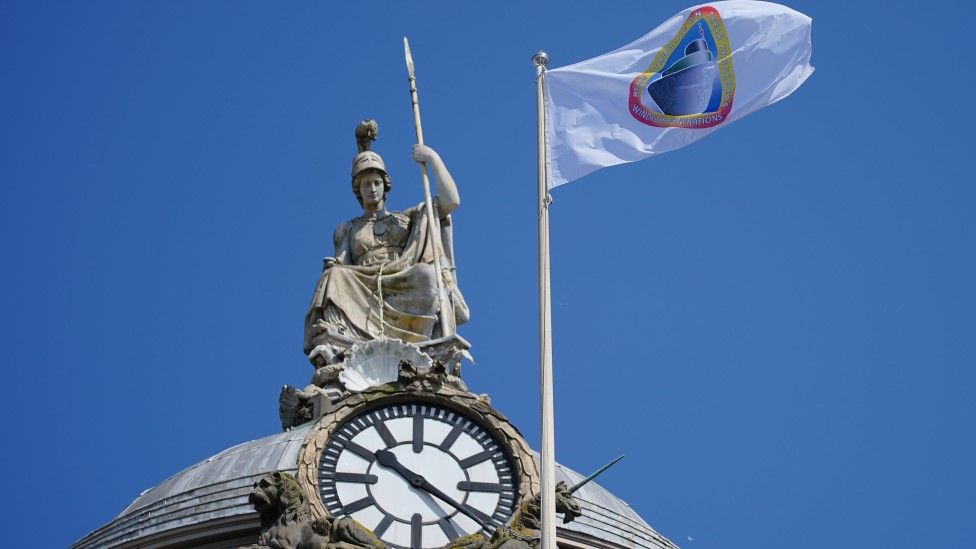 The Windrush flag flies over Liverpool Town Hall