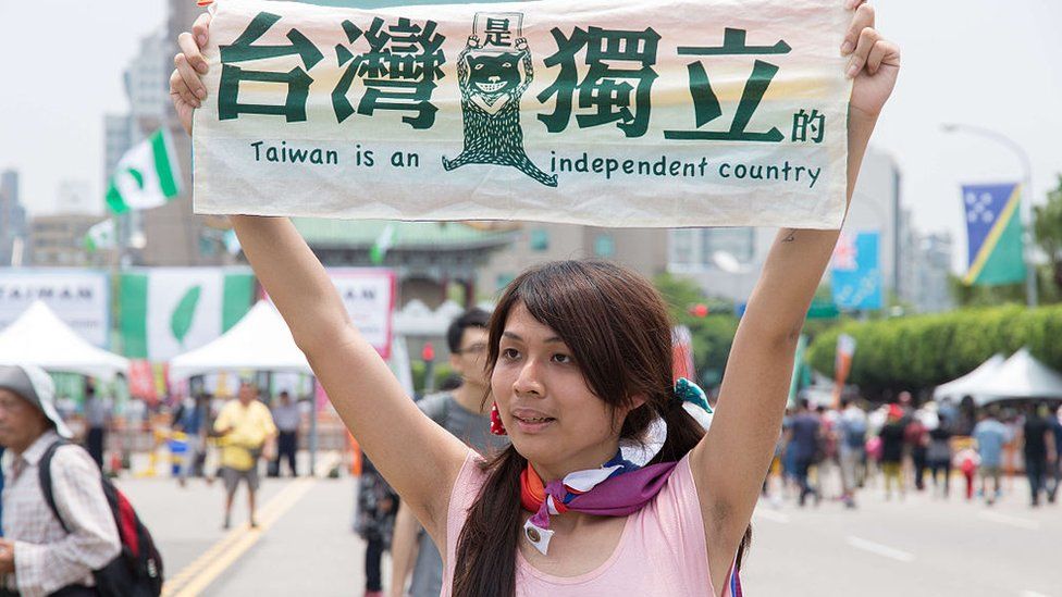 An activist holds a sign reading "Taiwan is an independent country" at the inauguration of President Tsai Ing-wen