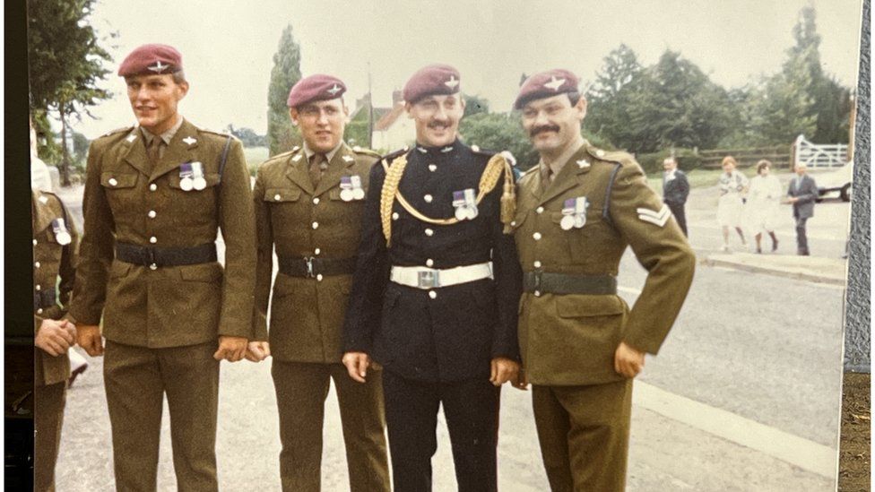 Keith Eamer in military uniform with his friends on his wedding day