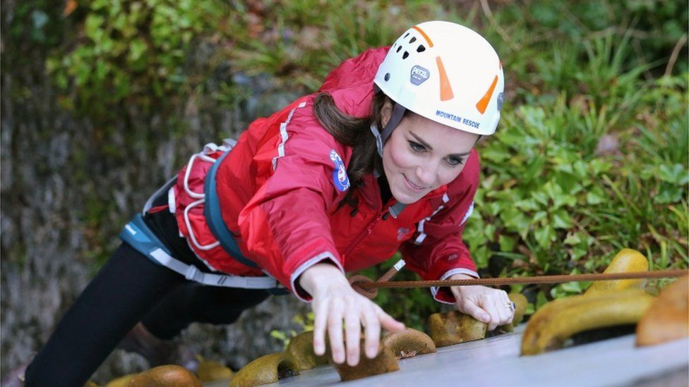 Duchess of Cambridge ascends a climbing wall as she visits the Towers Residential Outdoor Education Centre