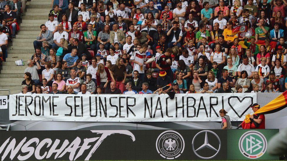 Fans of Germany present a banner to support Jerome Boateng