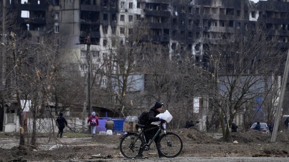 Civilian with bike in Mariupol
