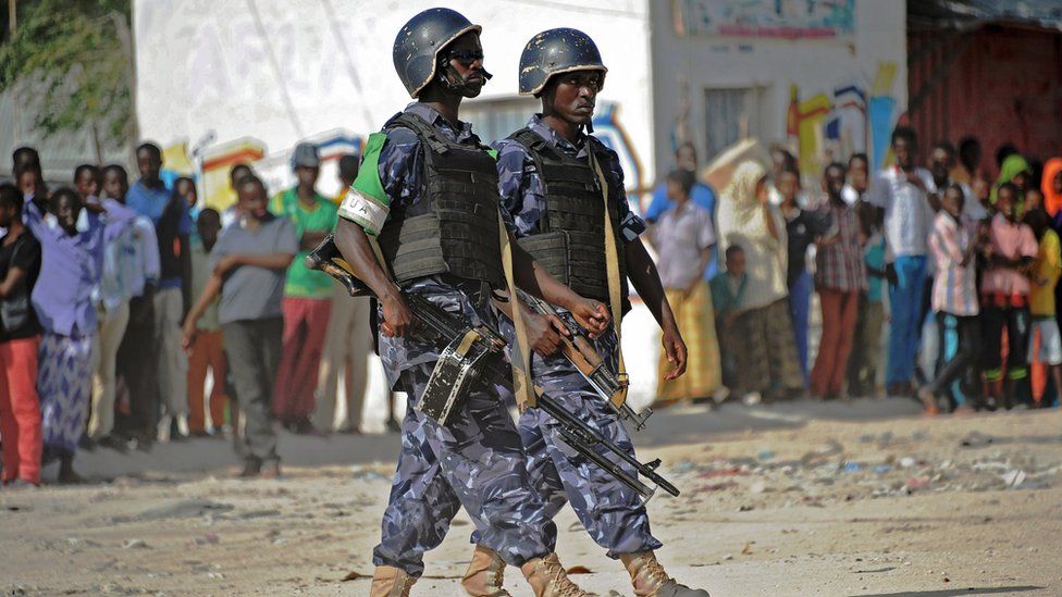 African Union Mission to Somalia (Amisom) soldiers patrol following a car bomb in Mogadishu - February 2015