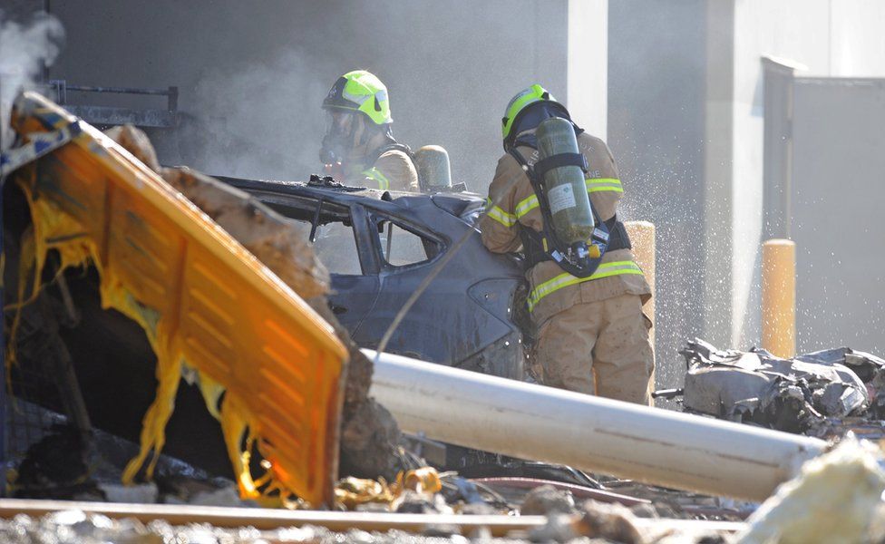 Firefighters at the scene of the crash near Essendon Airport (21 Feb 2017)