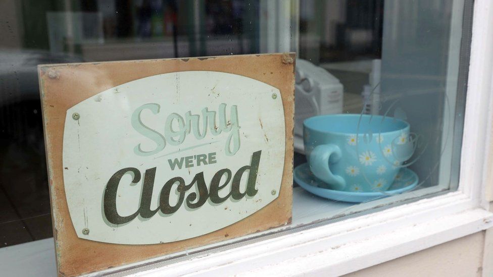 "Sorry We're Closed" sign in a shop window in Ballycastle, County Antrim