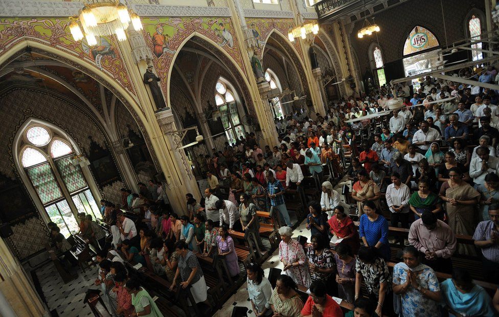 Indian Catholics pray during Friday afternoon service at the Holy Name Cathedral in Mumbai on 15 March 2013.