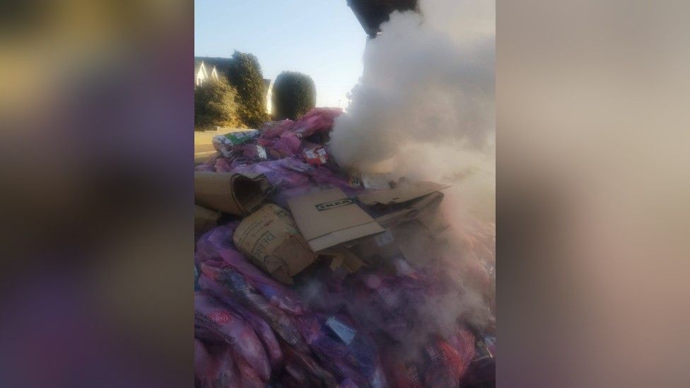 Smoke coming from a pile of bin bags