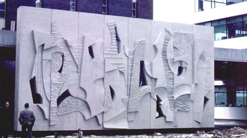 A large rectangular concrete sculpture created in the 1960s
