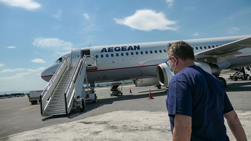 Man approaches Aegean Airlines plane