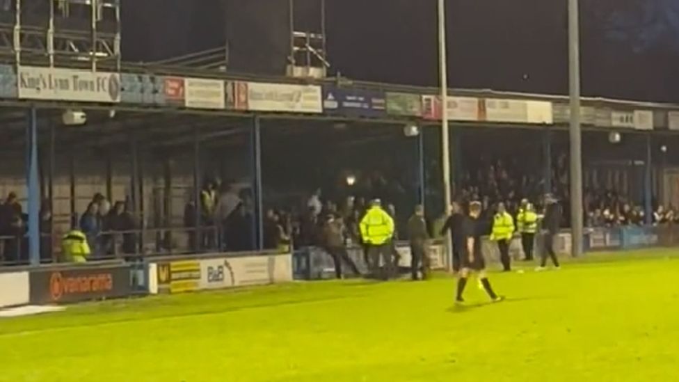 Fans appearing to fight at the King's Lynn Town FC vs Boston United match