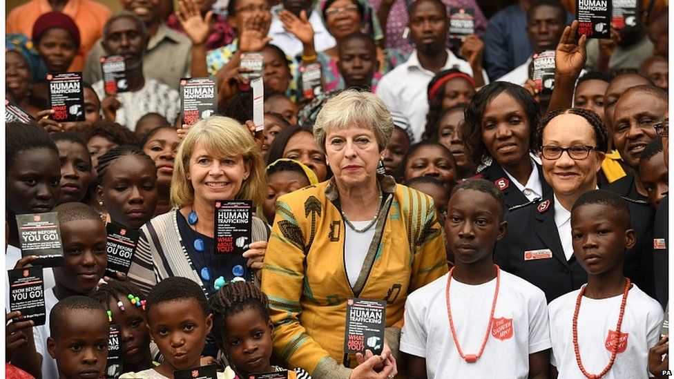 Theresa May and Foreign Office minister Harriet Baldwin meet Salvation Army workers in Lagos