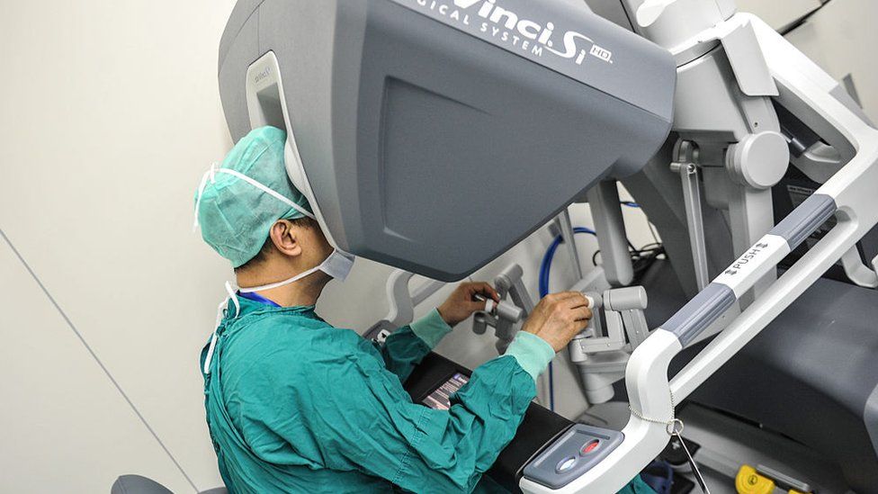 A surgeon operates a surgical robot at the First Affiliated Hospital of Sun Yat-sen University; 15 April 2015, in Guangzhou