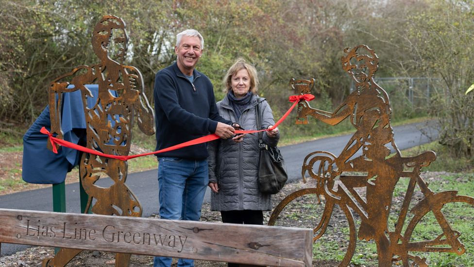 David Moorcroft and Eileen Sheridan with their statues