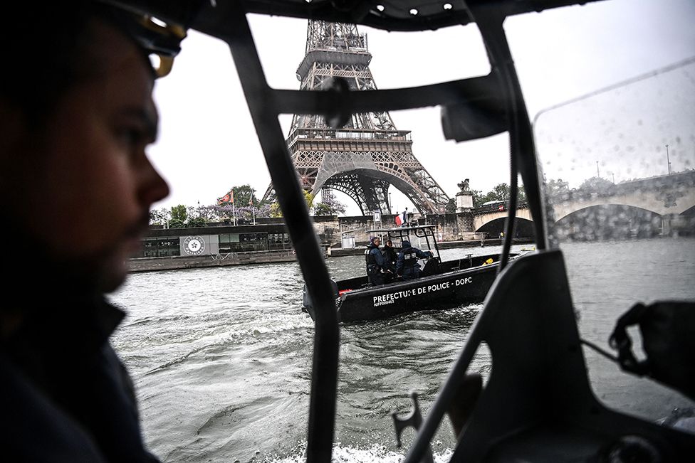 Members of the French police's River Brigade (Brigade Fluviale) patrol on boats near the Eiffel Tower on the Seine river in Paris on 9 May 2023