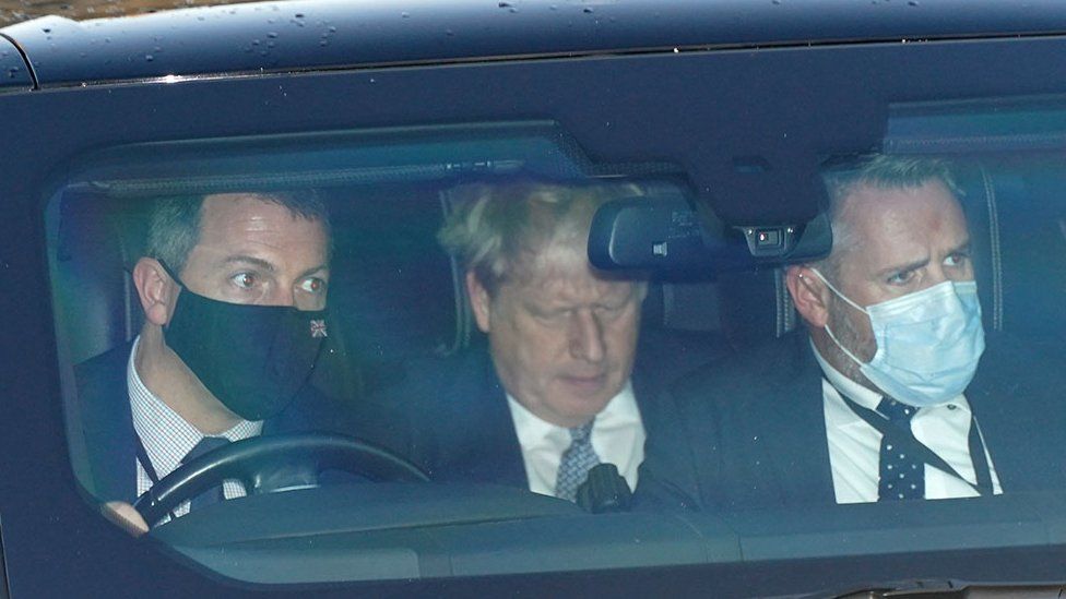 Prime Minister Boris Johnson (centre) leaves Houses of Parliament in Westminster, London, 12 January 2022
