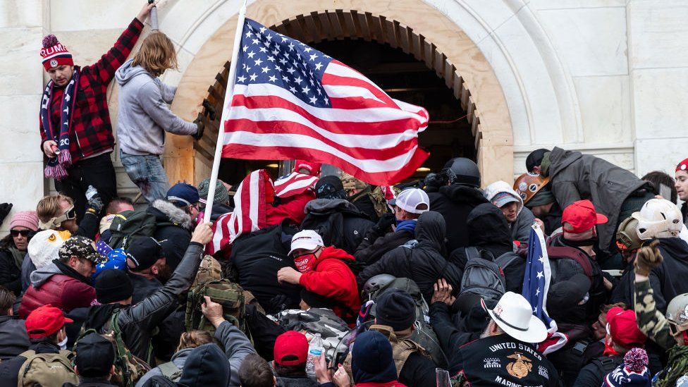 Rioters clash with police trying to enter Capitol building through the front doors - 6 January 2021