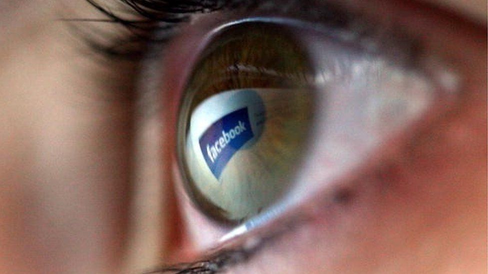 Facebook logo reflected in eyeball
