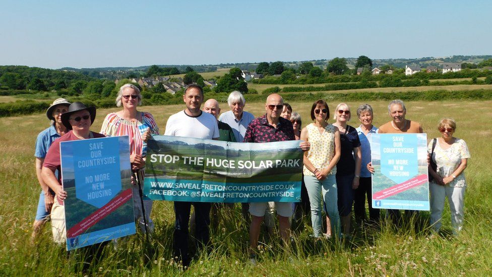 Image of campaigners on the proposed site