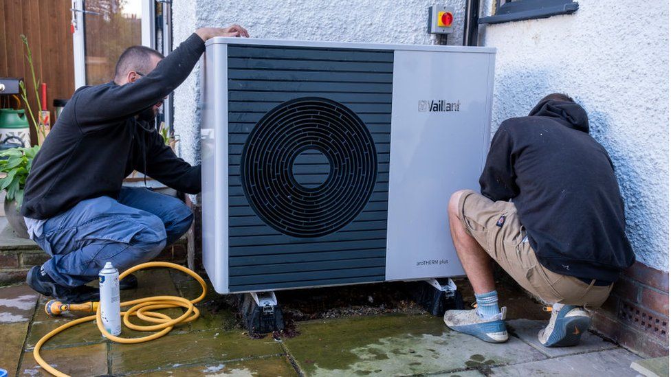 Technicians from Solaris Energy carry out the first annual service and clean on a Vaillant Arotherm plus 7kw air source heat pump that was installed into a 1930s built house on the 16th of September 2022 in Folkestone, United Kingdom.