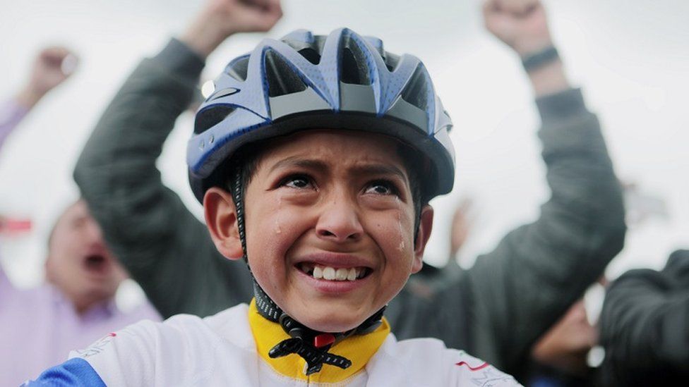 A boy cries while watching the Tour de France in Zipaquira