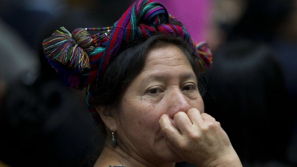 An indigenous woman listens to a prosecutor on the first day of hearings for a trial against a former military officer and former paramilitary fighter accused of sexual violence during Guatemala"s civil war in Guatemala City, Monday, Feb. 1, 2016.