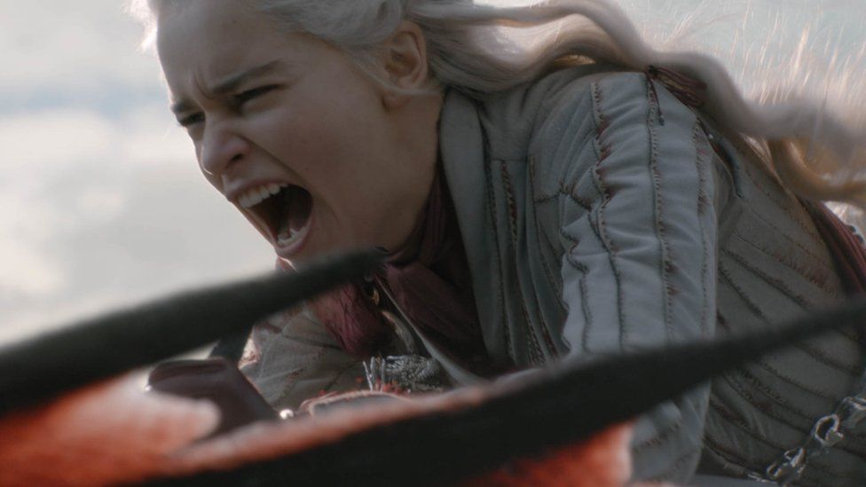 Daenerys Targaryen riding her dragon.