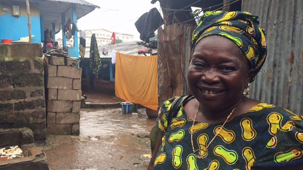 Memunatu Turay outside her home in Freetown