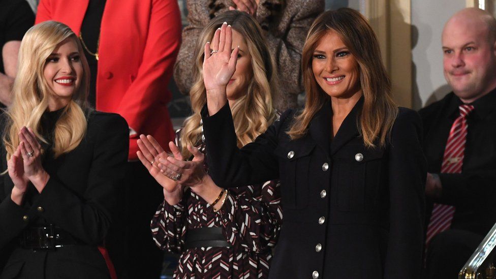 US First Lady Melania Trump (R) waves, flanked by senior adviser to the president, Ivanka Trump (L)