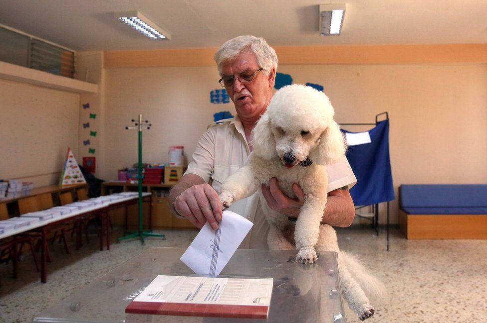 A man casts his vote during the general election at a polling station in Athens, Greece