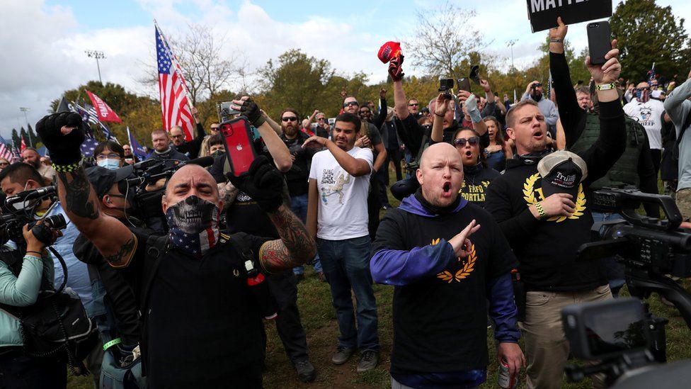 People gesture and shout slogans during a rally of the far right group Proud Boys, in Portland, Oregon, 26 September, 2020.