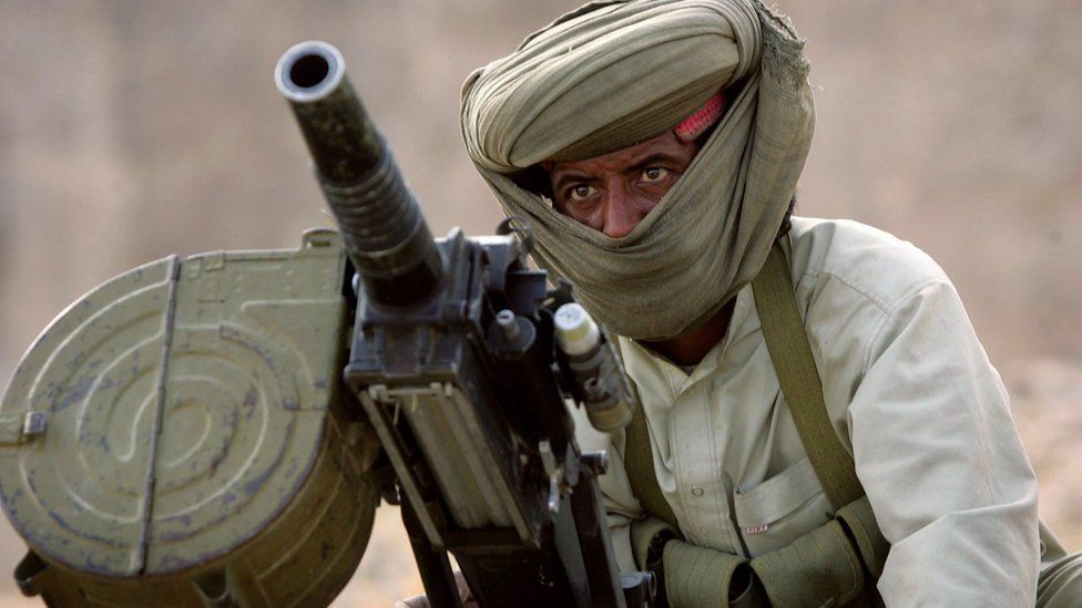 File photo: A Marri tribal guerrilla prepares to fire a grenade launcher at a Pakistani troop outpost January 31, 2006 near Kahan in the Pakistani province of Balochistan