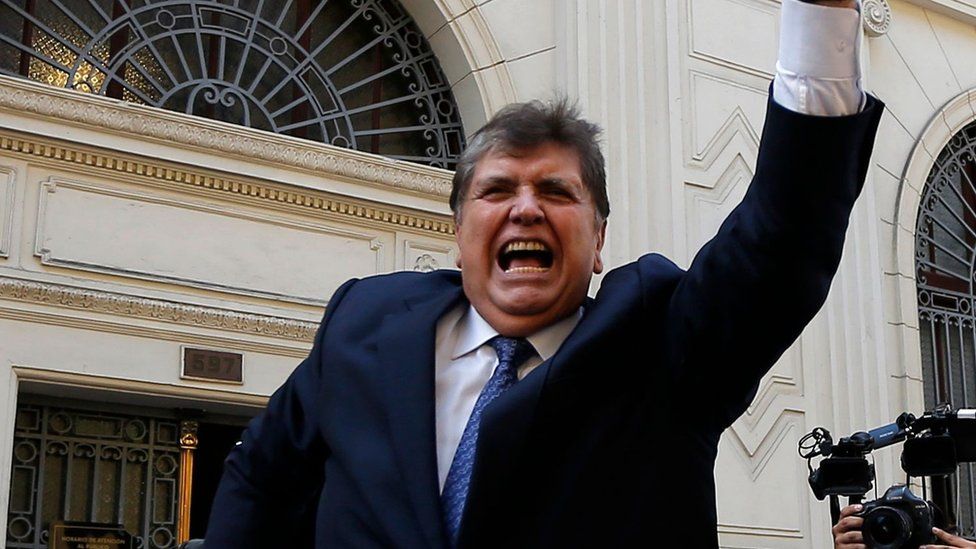 Former Peruvian President Alan Garcia (1985-1990 and 2006-2011) waves as he gets on a car, after testifying on Brazilian construction giant Odebrecht bribes case at the anti-corruption attorney's prosecutor office in Lima.