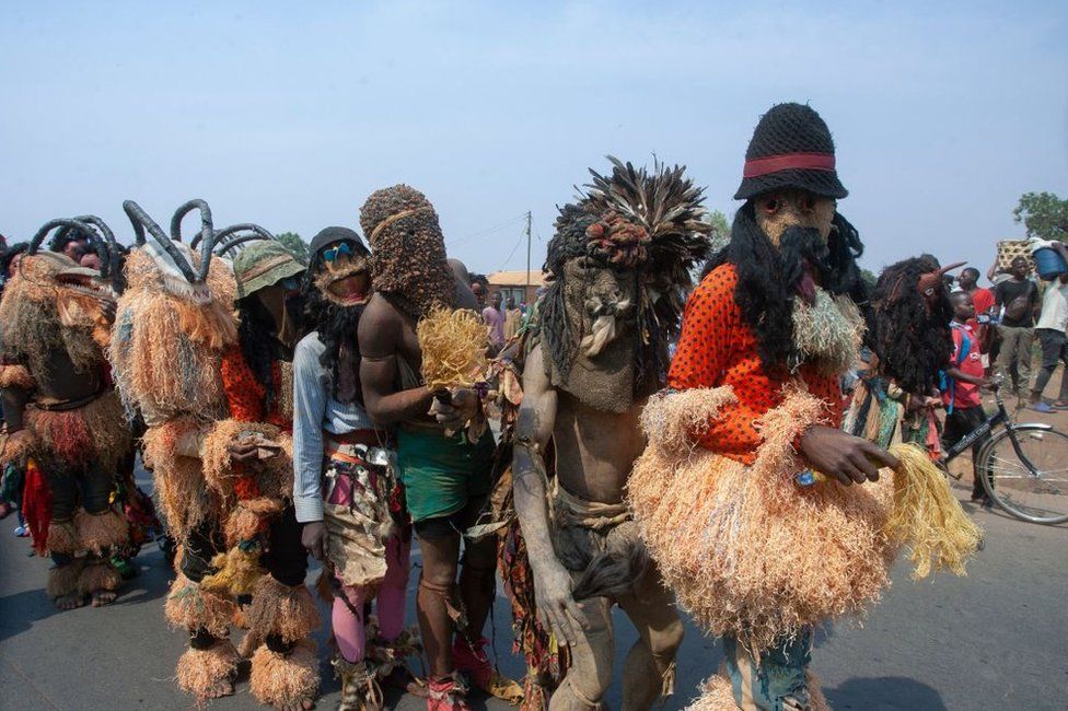 Gulewamkulu dancers of Malawi line up during a street cultural march at the beginning of the Chewa Heritage Foundation Cultural Day in Lilongwe, on October 14, 2023.