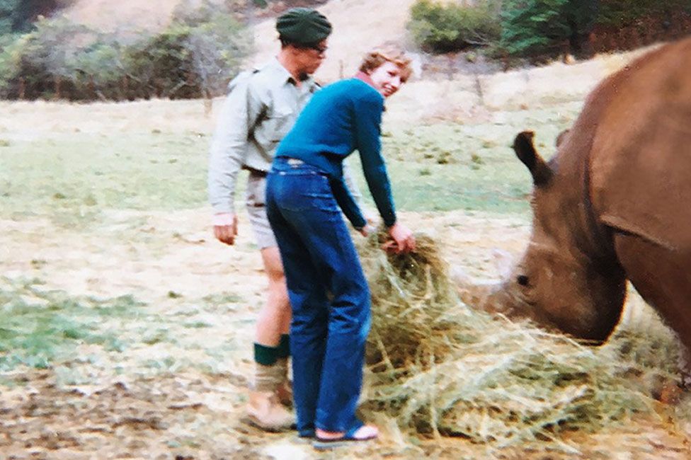 Janet Easton-Berry feeding a rhino at a game reserve in South Africa